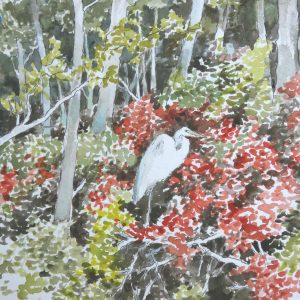 Egret Perched Amid Red Leaves at the Edge of the Woods